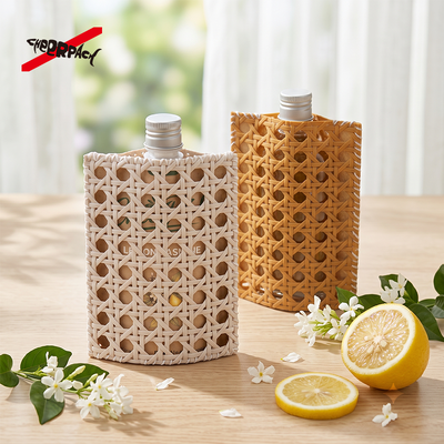 Reusable Rattan Woven Spout Pouch with Aluminum Cap | CheerPack Patented 100ml rattan-woven hollow-out spout pouch with reusable Sleeve and aluminum screw cap. Eco cosmetic packaging, OEM/ODM welcome.